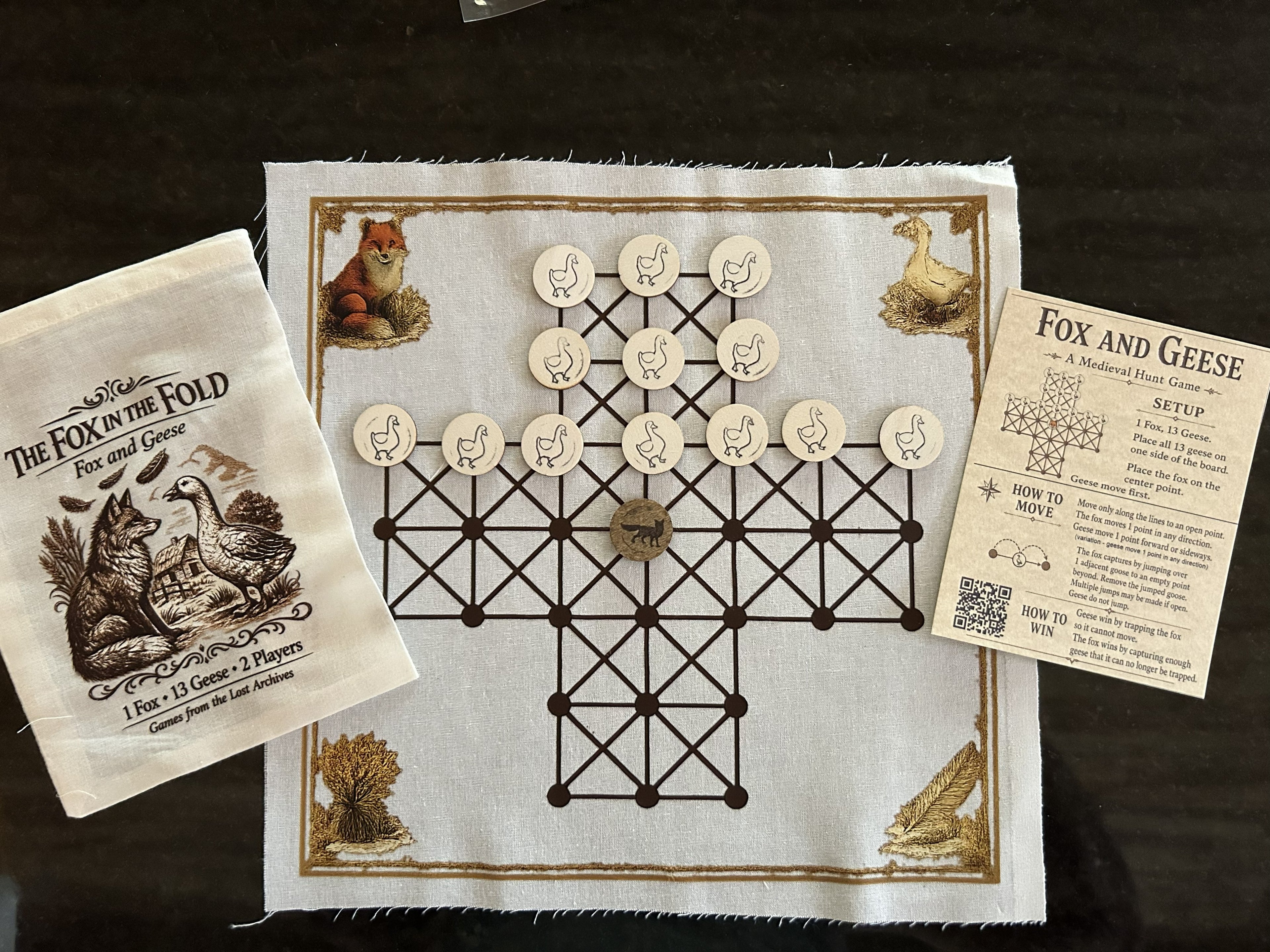 Fox and Geese game board, pieces, pouch, and rules card