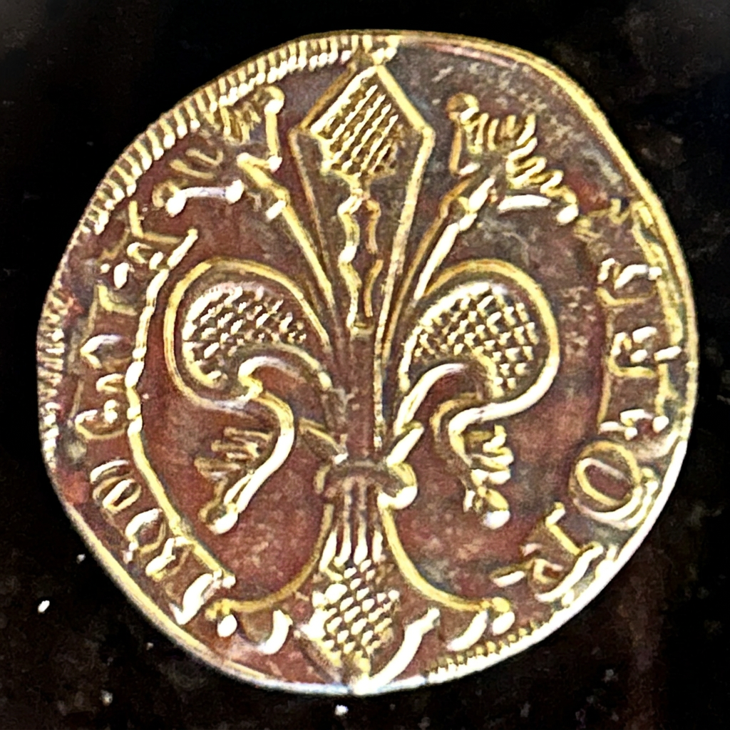 Florentine lily on a gold-colored florin replica coin