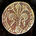 Florentine lily on a gold-colored florin replica coin