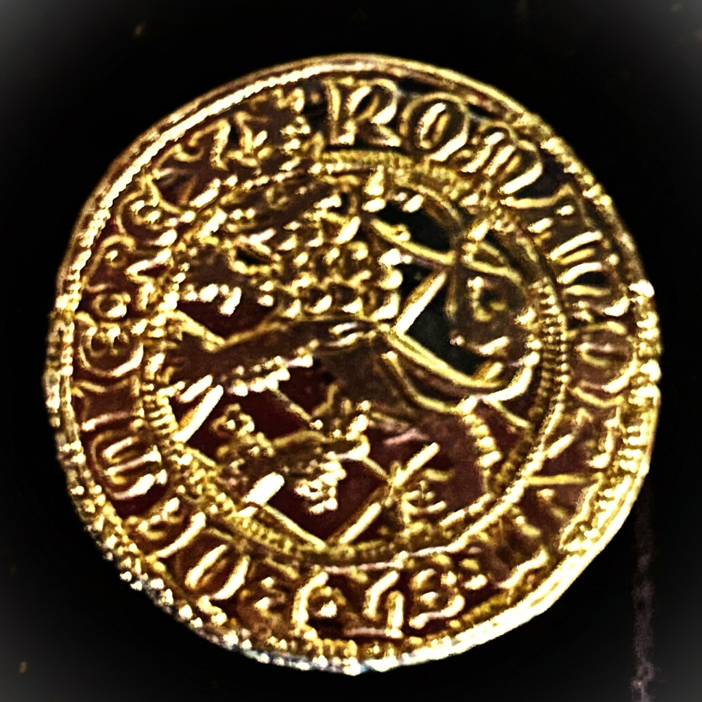 Heraldic shield side of a gold-colored ducat replica