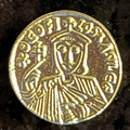 Single crowned imperial figure on a gold-colored Byzantine solidus replica