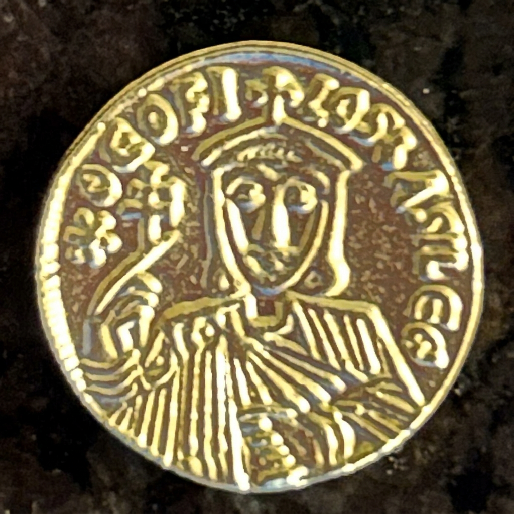 Single crowned imperial figure on a gold-colored Byzantine solidus replica